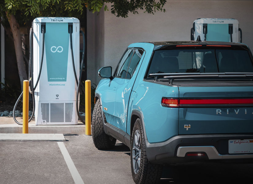 Loop level 3 DCFC ev charging station with rivian car